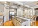 Large kitchen with a granite island, stainless steel refrigerator, and open access to a great room at 2952 Perimeter Cir, Buford, GA 30519