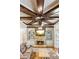 Living room featuring a custom ceiling, stone fireplace, built-in shelving, and comfortable seating at 2952 Perimeter Cir, Buford, GA 30519