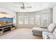 Bright living room featuring a TV, many windows, and a comfortable sectional at 2952 Perimeter Cir, Buford, GA 30519