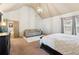 Spacious main bedroom featuring a vaulted ceiling, a sitting area, and large window at 2952 Perimeter Cir, Buford, GA 30519