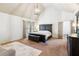Spacious main bedroom with vaulted ceilings, recessed lighting, and neutral color scheme at 2952 Perimeter Cir, Buford, GA 30519
