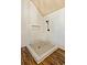 Modern tiled shower featuring a shower niche and updated shower head fixture at 2952 Perimeter Cir, Buford, GA 30519