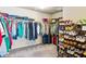 Large walk-in closet featuring ample shelving and hanging storage space for organization at 2952 Perimeter Cir, Buford, GA 30519