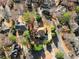 Bird's-eye view of a home showcasing its landscaped yard and roof in a quiet, tree-lined neighborhood at 971 Ashebrooke Ne Ct, Marietta, GA 30068
