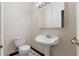 Bathroom with pedestal sink and toilet at 971 Ashebrooke Ne Ct, Marietta, GA 30068