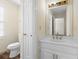 This cozy bathroom has an elegant vanity, large mirror and updated fixtures at 971 Ashebrooke Ne Ct, Marietta, GA 30068