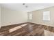 Bedroom with wood floors and windows with mini-blinds at 971 Ashebrooke Ne Ct, Marietta, GA 30068