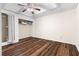 This bedroom features dark wood-look floors and a ceiling fan at 971 Ashebrooke Ne Ct, Marietta, GA 30068