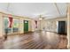 Large living area with hardwood floors, a ceiling fan, and several large windows at 971 Ashebrooke Ne Ct, Marietta, GA 30068