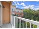 Relaxing covered balcony with views of mature trees and the building's exterior at 10 Perimeter Summit Ne Blvd # 4312, Atlanta, GA 30319
