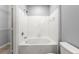 Bathroom showcasing a white tiled shower-tub, blending style and functionality at 10 Perimeter Summit Ne Blvd # 4312, Atlanta, GA 30319