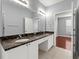 Bathroom features marble countertops, double sinks, and tiled floors, providing luxury at 10 Perimeter Summit Ne Blvd # 4312, Atlanta, GA 30319