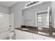 Bathroom featuring granite counters, a sink, a mirror, and a toilet next to the shower at 10 Perimeter Summit Ne Blvd # 4312, Atlanta, GA 30319