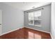 Bright bedroom with hardwood floors and a window offers a peaceful retreat at 10 Perimeter Summit Ne Blvd # 4312, Atlanta, GA 30319