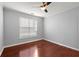 A cozy bedroom with natural light and a ceiling fan at 10 Perimeter Summit Ne Blvd # 4312, Atlanta, GA 30319