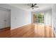 A bedroom offering hardwood floors, a ceiling fan, and a sliding glass door for balcony access at 10 Perimeter Summit Ne Blvd # 4312, Atlanta, GA 30319