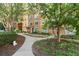 Exterior of a condo building with manicured landscaping and a walkway at 10 Perimeter Summit Ne Blvd # 4312, Atlanta, GA 30319