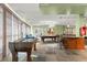 Spacious game room with foosball table, pool table, bar area, and comfortable seating at 10 Perimeter Summit Ne Blvd # 4312, Atlanta, GA 30319
