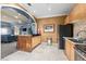 Clubhouse kitchen featuring stainless steel appliances, light wood cabinetry, and an island at 10 Perimeter Summit Ne Blvd # 4312, Atlanta, GA 30319