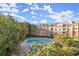 Pool area surrounded by beautiful trees and a condo building at 10 Perimeter Summit Ne Blvd # 4312, Atlanta, GA 30319
