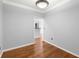 Bright room with hardwood floors, neutral walls, and an open doorway adds to the home's flow at 10 Perimeter Summit Ne Blvd # 4312, Atlanta, GA 30319