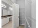 Walk-in closet with white wire shelving for optimal organization, enhancing storage at 10 Perimeter Summit Ne Blvd # 4312, Atlanta, GA 30319