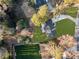 Aerial view of a home featuring pristine landscaping, a sports court, and a long driveway at 198 Johnson Ferry Nw Rd, Atlanta, GA 30328
