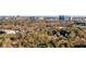 Aerial view of the city skyline framed by mature trees, showcasing the property's location and surroundings at 198 Johnson Ferry Nw Rd, Atlanta, GA 30328