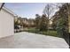 View from the balcony overlooking a lush green lawn and mature trees at 198 Johnson Ferry Nw Rd, Atlanta, GA 30328