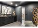 Modern home bar area with stylish black cabinets, marble countertops, and a wine cooler at 198 Johnson Ferry Nw Rd, Atlanta, GA 30328