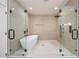Bathroom featuring a modern soaking tub and glass-enclosed shower with a rainfall showerhead at 198 Johnson Ferry Nw Rd, Atlanta, GA 30328