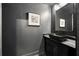 Modern bathroom with a black vessel sink, marble countertop, and a sleek, framed mirror at 198 Johnson Ferry Nw Rd, Atlanta, GA 30328