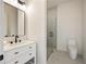 Clean and modern bathroom featuring a glass shower and white vanity at 198 Johnson Ferry Nw Rd, Atlanta, GA 30328