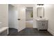 Modern bathroom featuring a vessel sink, sleek mirror, and stylish lighting fixtures at 198 Johnson Ferry Nw Rd, Atlanta, GA 30328