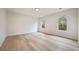 Light-filled bedroom with two large windows, and light hardwood floors at 198 Johnson Ferry Nw Rd, Atlanta, GA 30328
