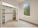 Walk in closet with custom storage shelving and large window at 198 Johnson Ferry Nw Rd, Atlanta, GA 30328