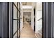 Bright foyer with black framed glass door, hardwood floors, and views into the living spaces at 198 Johnson Ferry Nw Rd, Atlanta, GA 30328