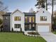 Modern home showcasing a well-manicured lawn, contrasting dark and white exterior, and a two-car garage at 198 Johnson Ferry Nw Rd, Atlanta, GA 30328