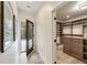 Hallway leading to a walk-in closet with custom shelving and storage at 198 Johnson Ferry Nw Rd, Atlanta, GA 30328