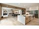 Open kitchen with island, modern appliances, dining area, and views of the living room at 198 Johnson Ferry Nw Rd, Atlanta, GA 30328