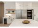 Gourmet kitchen featuring stainless steel appliances, a wine cooler, and quartz countertops at 198 Johnson Ferry Nw Rd, Atlanta, GA 30328