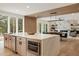 Kitchen island featuring stainless appliances, breakfast bar, and open concept floorplan at 198 Johnson Ferry Nw Rd, Atlanta, GA 30328