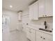 Laundry room with ample counter space, cabinets and appliances at 198 Johnson Ferry Nw Rd, Atlanta, GA 30328