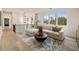 Contemporary living room with stylish sofa set, lighting, and large windows at 198 Johnson Ferry Nw Rd, Atlanta, GA 30328