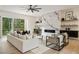 Bright living room with a marble fireplace and a sliding glass door leading to a deck at 198 Johnson Ferry Nw Rd, Atlanta, GA 30328