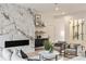 Elegant living room featuring a marble fireplace and a modern wine cellar at 198 Johnson Ferry Nw Rd, Atlanta, GA 30328