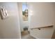 Modern stairway with light wood treads and a stylish light fixture at 198 Johnson Ferry Nw Rd, Atlanta, GA 30328
