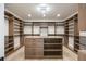 Large walk-in closet with custom shelving, drawers, and ample storage space at 198 Johnson Ferry Nw Rd, Atlanta, GA 30328