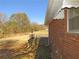 View of the expansive backyard featuring a brick home exterior and a private outdoor area at 2870 Whiteview Nw Dr, Acworth, GA 30101