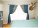 Cozy bedroom featuring bright windows and a unique mounted deer head for rustic charm at 2870 Whiteview Nw Dr, Acworth, GA 30101